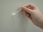 Wipe the test area with a cotton swab moistened with buffer solution.