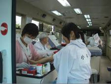 [Scene from inside a blood collection vehicle]