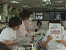 [Scene from inside a blood collection vehicle]